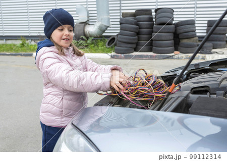 Children's, auto mechanic works in the garage. Outdoor repair services 99112314