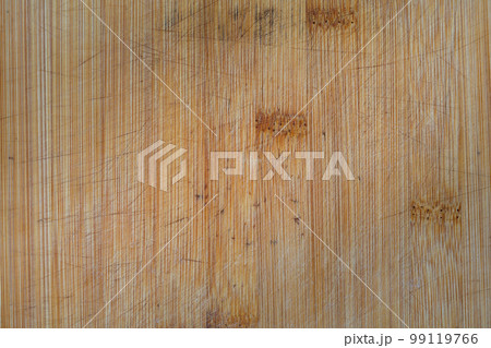 Old using rugged wooden cutting kitchen board texture, vertical fibers. 99119766