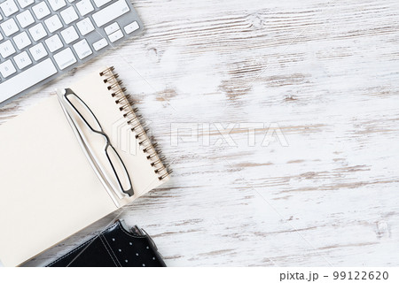 Still life of office workspace with supplies Still life of office workspace with supplies 99122620