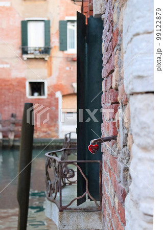 Side view of old brick wall building with shutters window. European architecture. Side view of old brick wall building with shutters window. European architecture. 99122879