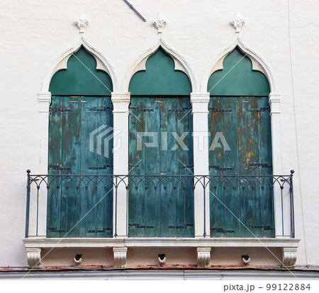 Stone wall with balcony and window of the old mediterranean house photo. Venetian architecture. Stone wall with balcony and window of the old mediterranean house photo. Venetian architecture. 99122884
