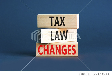 Tax law changes symbol. Concept words Tax law changes on wooden blocks on a beautiful grey table grey background. Business tax law changes concept. Copy space. 99123045