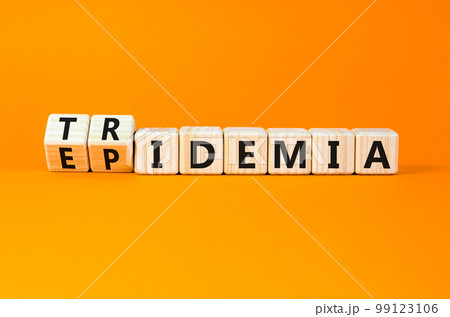 Covid-19 epidemic or tridemic symbol. Concept word Epidemic and Tridemic on wooden cubes. Beautiful orange background. Medical Covid-19 epidemic or tridemic concept. Copy space 99123106