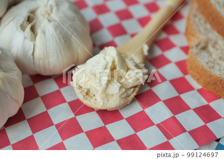 top view of garlic spread on a spoon top view of garlic spread on a spoon 99124697