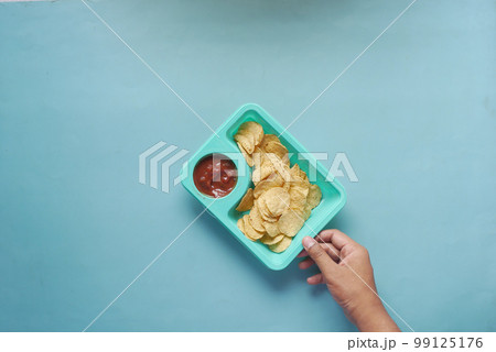 a bowl of chips and salsa on table , a bowl of chips and salsa on table , 99125176
