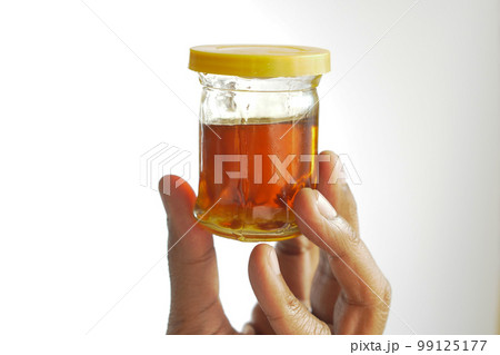 fresh honey in a glass jar 99125177