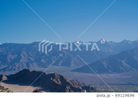 Leh town seen from above with many houses and mountains surrounded at Ladakh, in the Indian Himalayas. 99129696