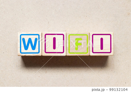 Color letter block in word wifi on wood background Color letter block in word wifi on wood background 99132104