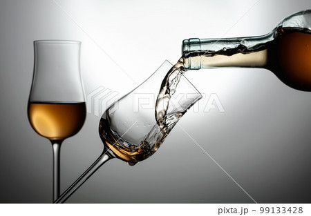Glasses of premium alcohol. 99133428
