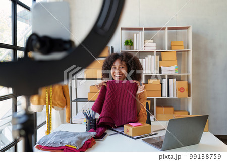 Beautiful Businesswoman start small business. A woman works from home delivering parcels online. Entrepreneurs, SME delivery concept 99138759