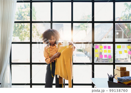 Portrait of young african american woman fashion designer stylish working at fashion studio 99138760