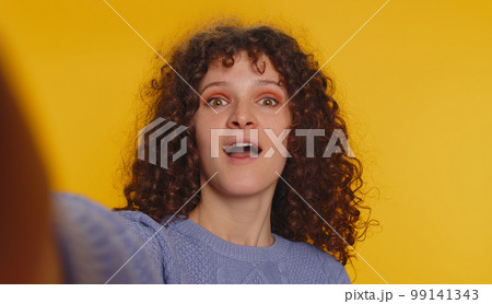 Excited amazed woman surprise looking at camera with big eyes, shocked by sudden victory wow emotion Excited amazed woman surprise looking at camera with big eyes, shocked by sudden victory wow emotion 99141343
