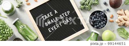 Take a small step every day letter board quote flat lay Take a small step every day letter board quote flat lay 99144651