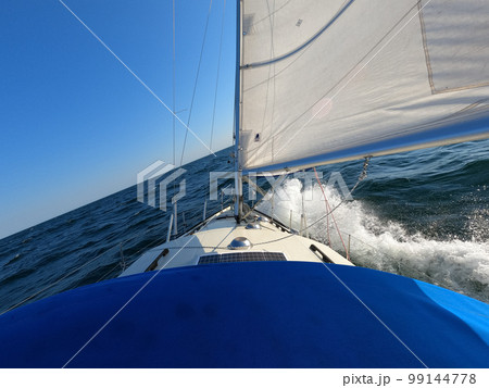 Sailboat against storm and waves in open sea. Concept of travel, adventure and vacation. 99144778
