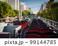 View from open roof of red, turistic hop on bus with tourists inside. Vacation, travel concept 99144785