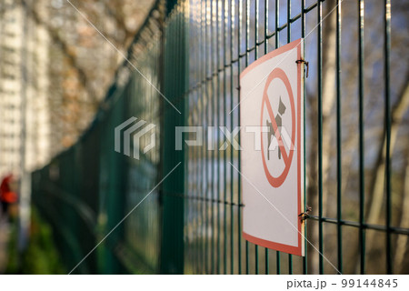 No dogs allowed sing on a fence 99144845
