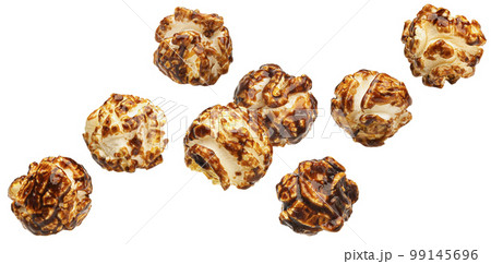 Falling caramel popcorn isolated on white background Falling caramel popcorn isolated on white background 99145696