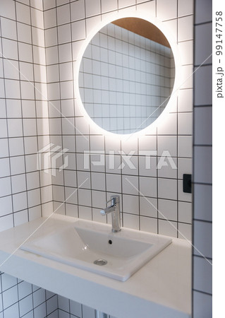 Sink and mirror in the bathroom. Element of interirior 99147758
