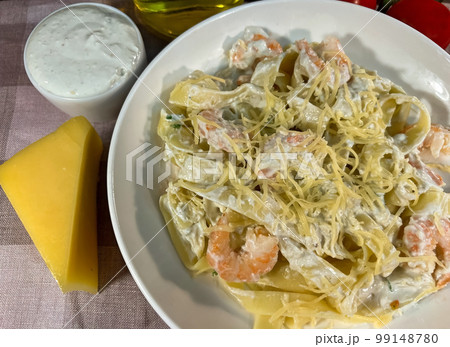 Pasta with shrimps and blue cheese sauce Pasta with shrimps and blue cheese sauce 99148780