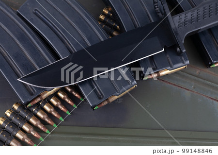 Bayonet and ammunition belt with cartridges on ammunition boxes Bayonet and ammunition belt with cartridges on ammunition boxes 99148846