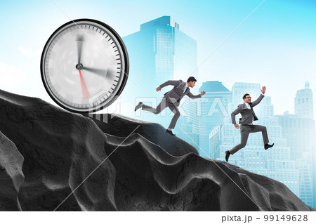 Businessman in the time management concept Businessman in the time management concept 99149628