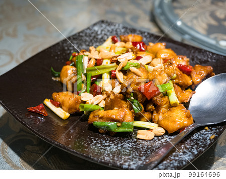Kung Pao chicken on black plate Kung Pao chicken on black plate 99164696
