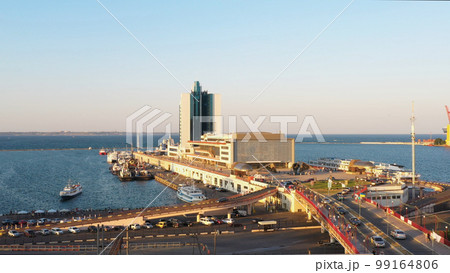 Hotel Odessa and the cruise ship terminal at Odesa port. View from the Potemkin Stairs. Evening city and sea scape. 99164806