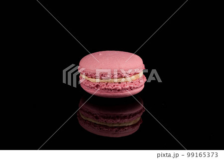 Colorful macaroon over black background Colorful macaroon over black background 99165373