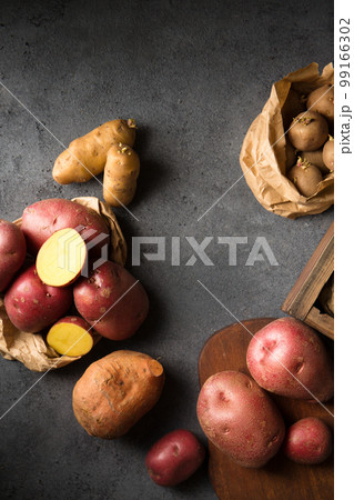 Germination of sprouts on potatoes, top view Germination of sprouts on potatoes, top view 99166302