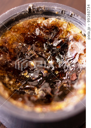 Rosin in a jar on a wooden table Rosin in a jar on a wooden table 99168734
