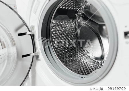 Household machine for washing fabric laundry with an open lid for loading in a household sanitary, technical room. Household machine for washing fabric laundry with an open lid for loading in a household sanitary, technical room. 99169709