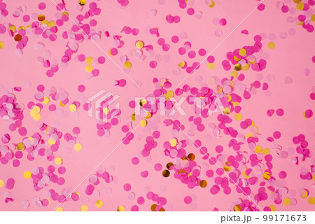 Pink abstract confetti background with lots of falling circles. Festive decorative element of tinsel for design Pink abstract confetti background with lots of falling circles. Festive decorative element of tinsel for design 99171673