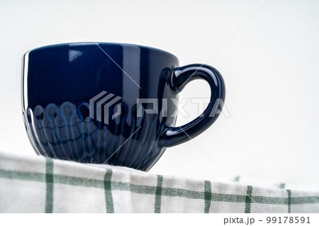Simple ceramic blue crockery on kitchen counter 99178591