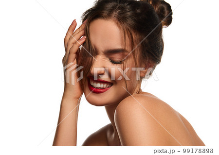 Tenderness. One beautiful brunette girl with well-kept skin and nude makeup posing against white studio background. Concept of natural beauty Tenderness. One beautiful brunette girl with well-kept skin and nude makeup posing against white studio background. Concept of natural beauty 99178898