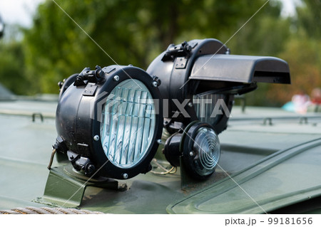 The front lights of an armored personnel carrier APC in close-up. The front lights of an armored personnel carrier APC in close-up. 99181656