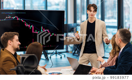 Young worker leading business meeting about cryptocurrencies in an office 99183977