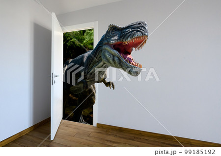 Tyrannosaurus Rex entering a door. Animal watching from a wall 99185192