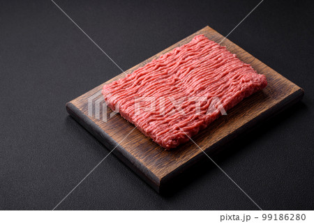 Raw beef or pork mince with salt spices and herbs Raw beef or pork mince with salt spices and herbs 99186280