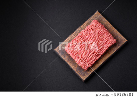 Raw beef or pork mince with salt spices and herbs 99186281