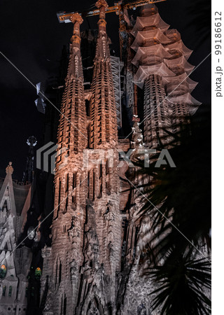 Night view of the La Sagrada Familia cathedral. Impressive cathedral designed and unfinished by Gaudi in the center of Barcelona. Night view of the La Sagrada Familia cathedral. Impressive cathedral designed and unfinished by Gaudi in the center of Barcelona. 99186612
