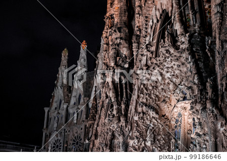 Night view of the La Sagrada Familia cathedral. Impressive cathedral designed and unfinished by Gaudi in the center of Barcelona. 99186646
