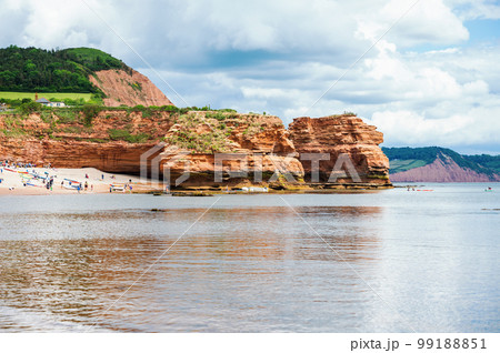 Rock formations in Ladram Bay, United Kingdom. View of the beach and red and orange cliffs and the sea, Jurassic coast, selective focus 99188851