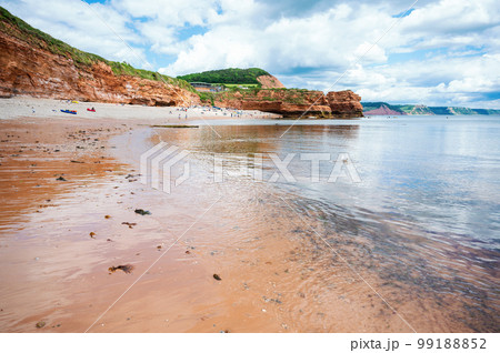 Rock formations in Ladram Bay, United Kingdom. View of the beach and red and orange cliffs and the sea, Jurassic coast, selective focus 99188852