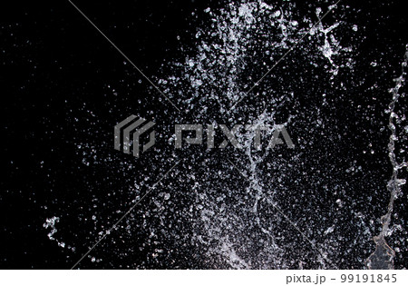 Shape form droplet of Water splashes into drop water attack fluttering in air and stop motion freeze shot. Splash Water for texture graphic resource elements, black background isolated Shape form droplet of Water splashes into drop water attack fluttering in air and stop motion freeze shot. Splash Water for texture graphic resource elements, black background isolated 99191845
