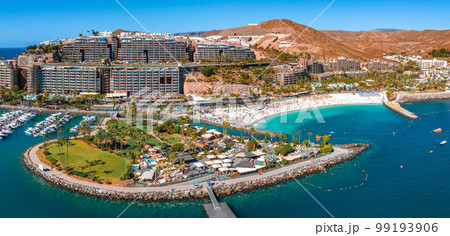 Beautiful aerial landscape with Anfi beach and resort, Gran Canaria, Spain. Luxury hotels, turquoise water, sandy beaches in Spain. Luxury beach vacation concept. Heart shaped island. Beautiful aerial landscape with Anfi beach and resort, Gran Canaria, Spain. Luxury hotels, turquoise water, sandy beaches in Spain. Luxury beach vacation concept. Heart shaped island. 99193906