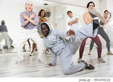 Group of multinational people practicing new modern dance techniques 99194010