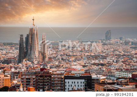 Beautiful aerial view of the Barcelona city with a Sagrada Familia cathedral standing in the city center. 99194201