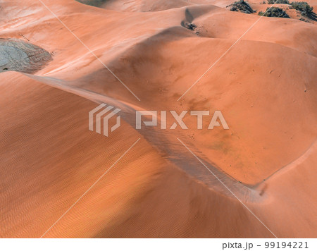 Panoramic aerial scene of the Maspalomas Dunes in Playa del Ingles, Maspalomas, Gran Canaria, Spain. Endless desert sands. Magical safari dunes. 99194221