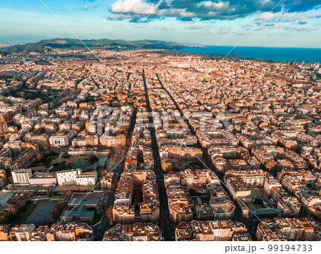 Barcelona street aerial view with beautiful patterns in Spain. Barcelona sunset skyline aerial view with buildings in Spain. Magical sunset over Barcelona. Barcelona street aerial view with beautiful patterns in Spain. Barcelona sunset skyline aerial view with buildings in Spain. Magical sunset over Barcelona. 99194733