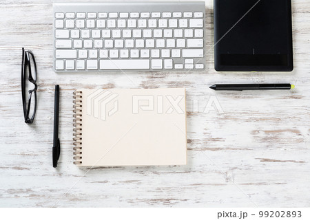 Still life of office workspace with supplies Still life of office workspace with supplies 99202893
